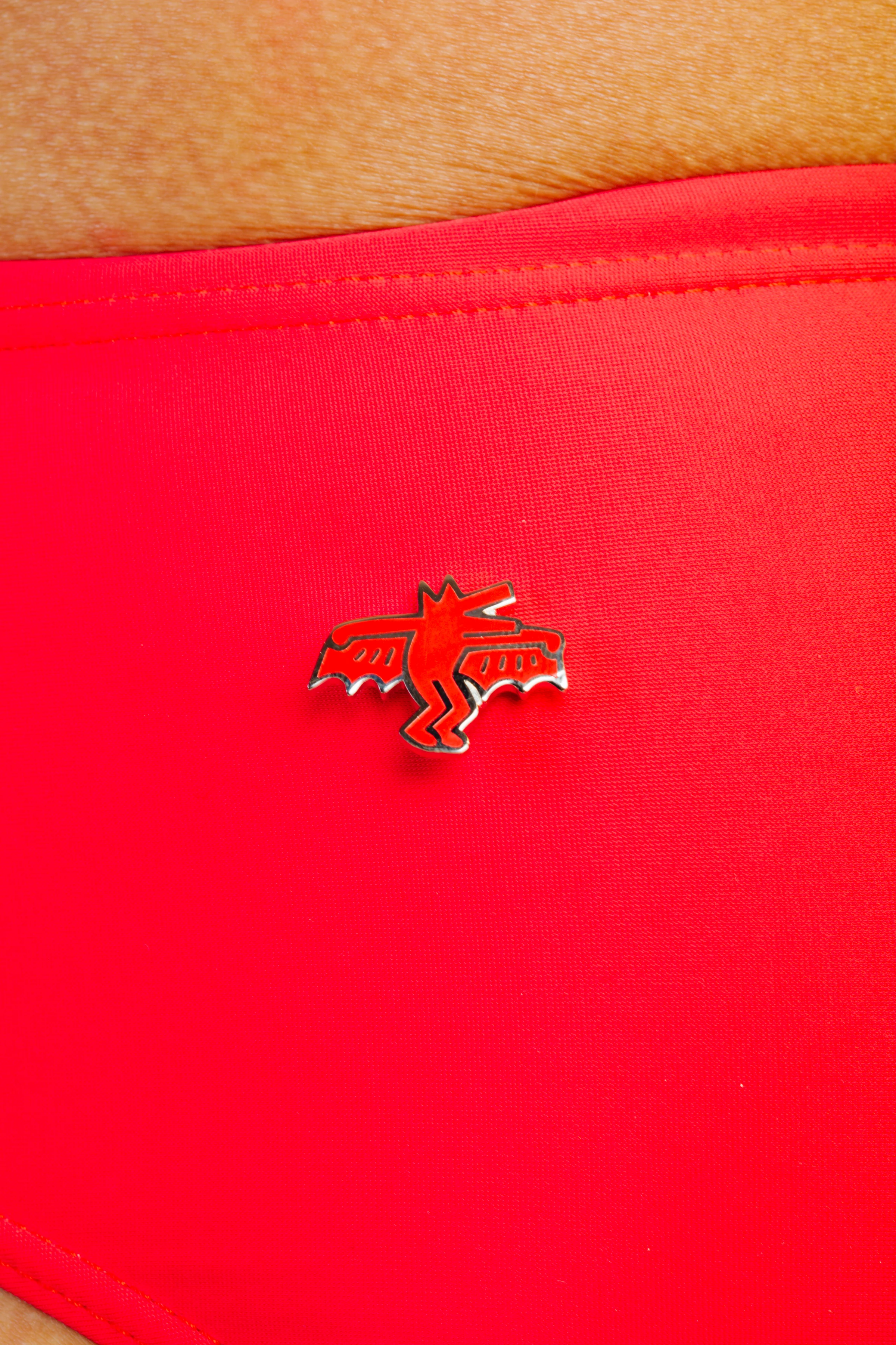 KEITH HARING BAT DOG PIN - RED