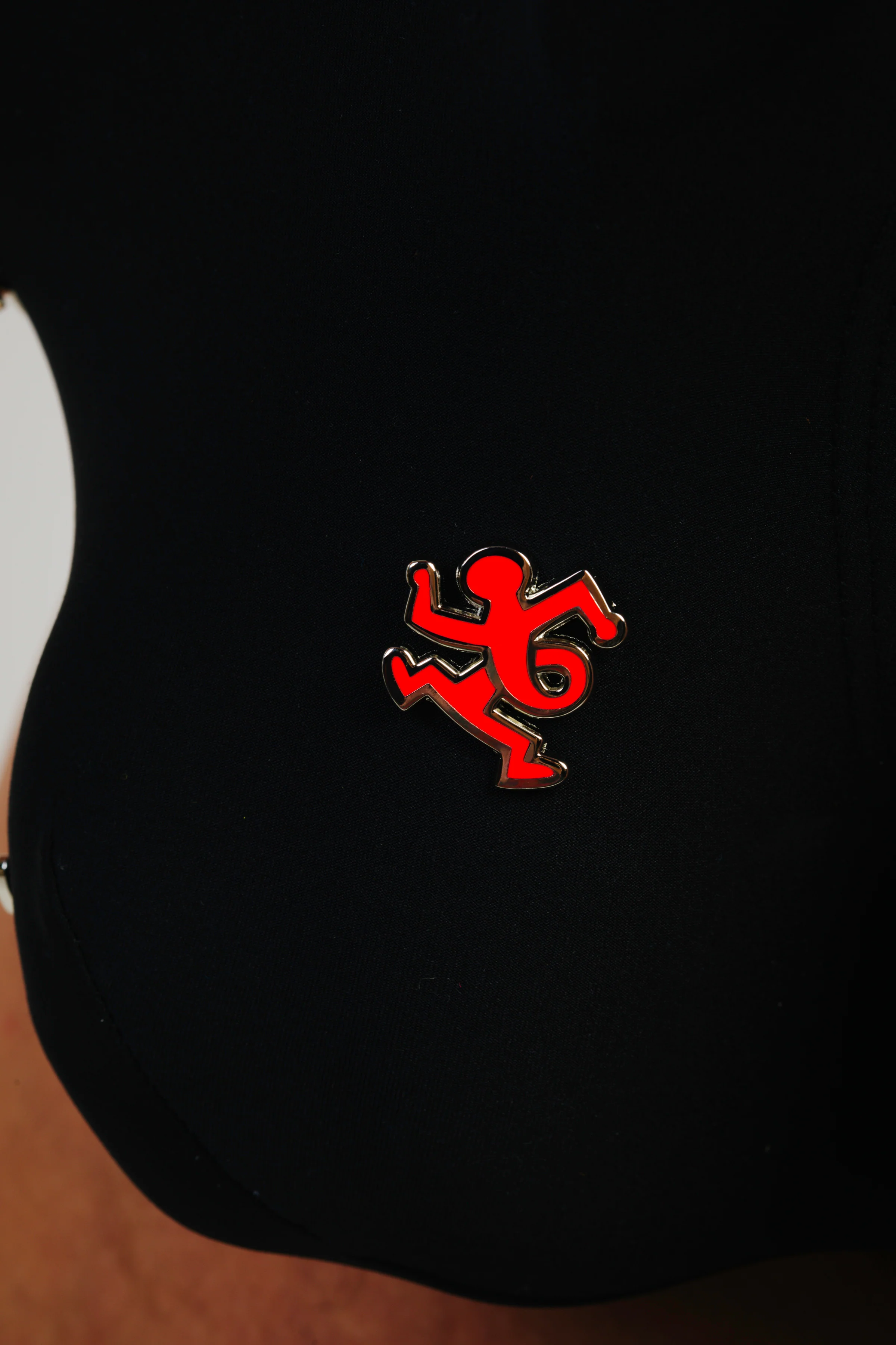 KEITH HARING TWIST MAN PIN - RED
